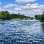 A scenic river-level view of the San Joaquin River